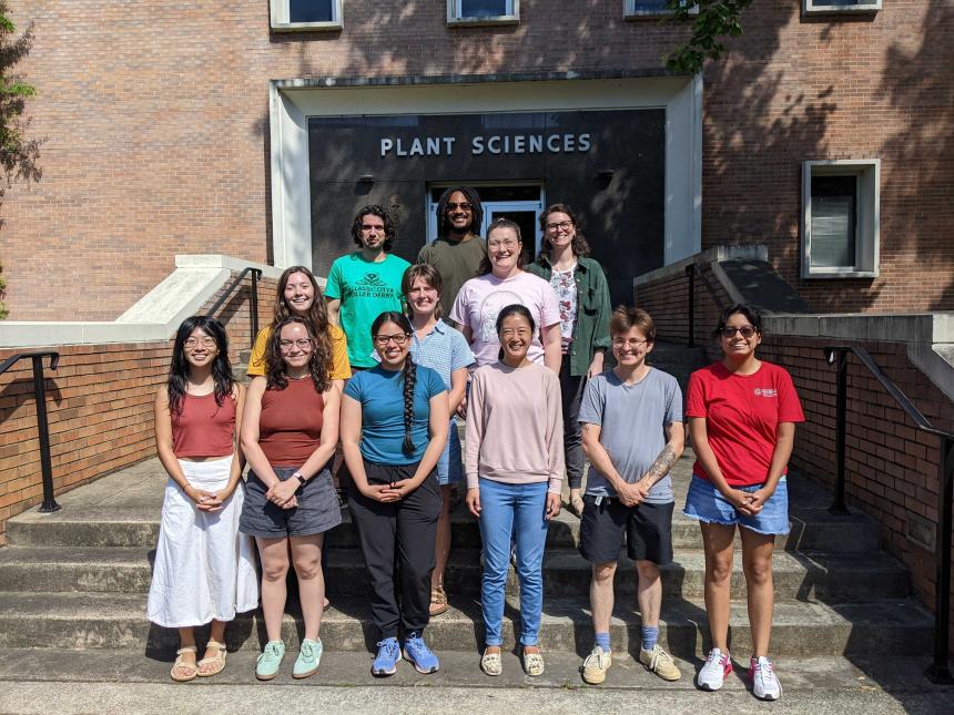 Group of 12 people in front of Miller plant sciences